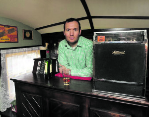John Walsh behind the counter of his Shebeen.