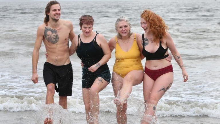 Hardy swimmers take to Galway Bay for Christmas Dip