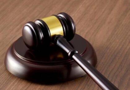 Neighbour punched partygoer and stole her phone, court told